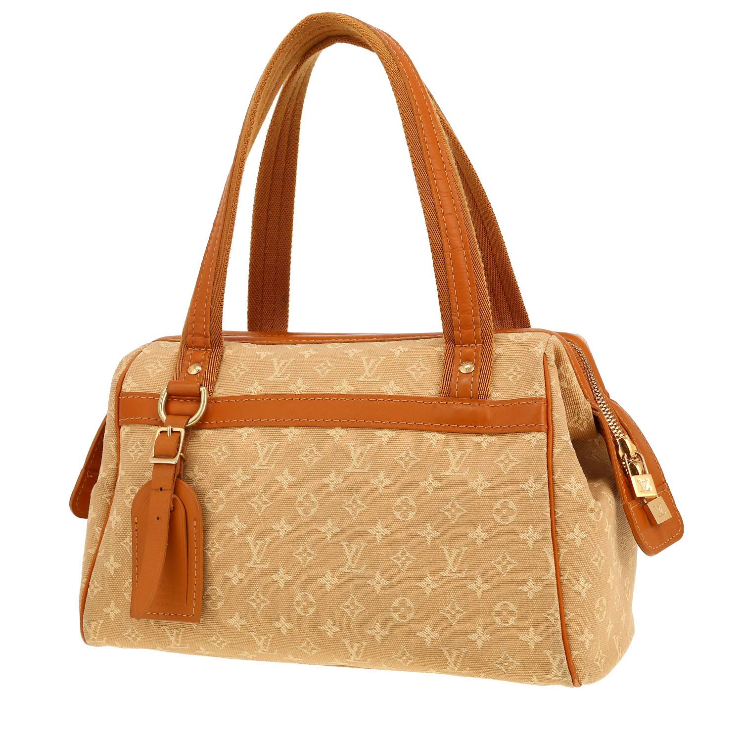 Louis Vuitton   handbag  in beige monogram canvas  and brown leather