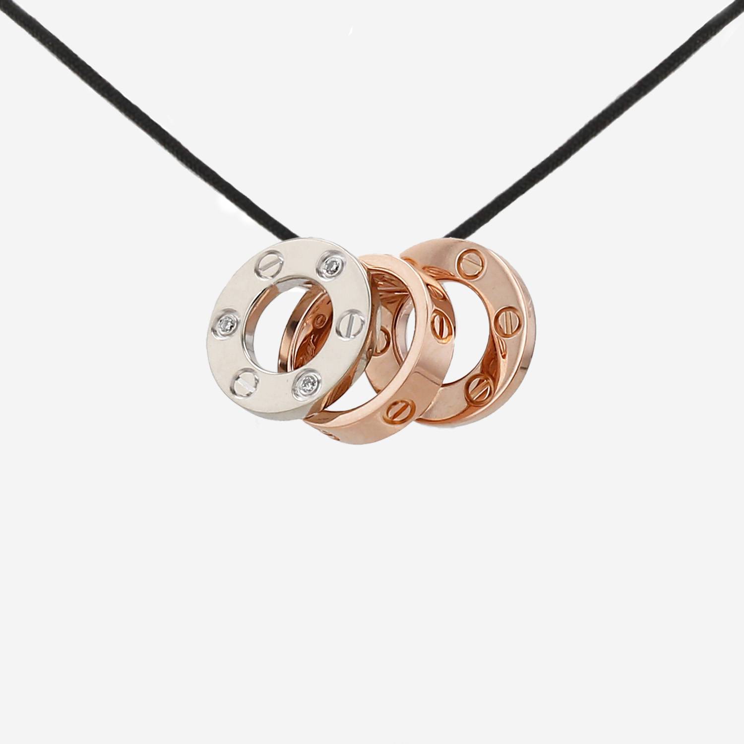 Cartier Love pendant in pink gold, white gold and diamonds