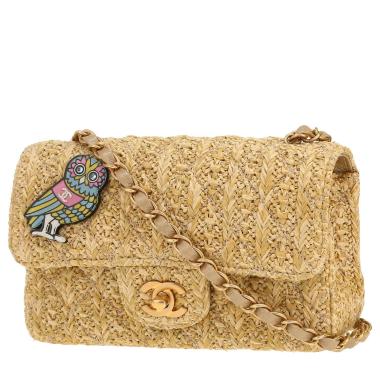 Bolso bandolera Chanel  Mini Timeless en raffia beige y cuero dorado