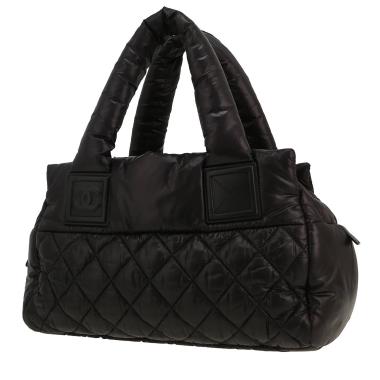 Sac à main Chanel  Coco Cocoon petit modèle  en toile matelassée noire et cuir noir
