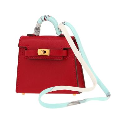 Accessoire de sac Hermès  Kelly Twilly bag charm en cuir Tadelakt rouge et soie multicolore