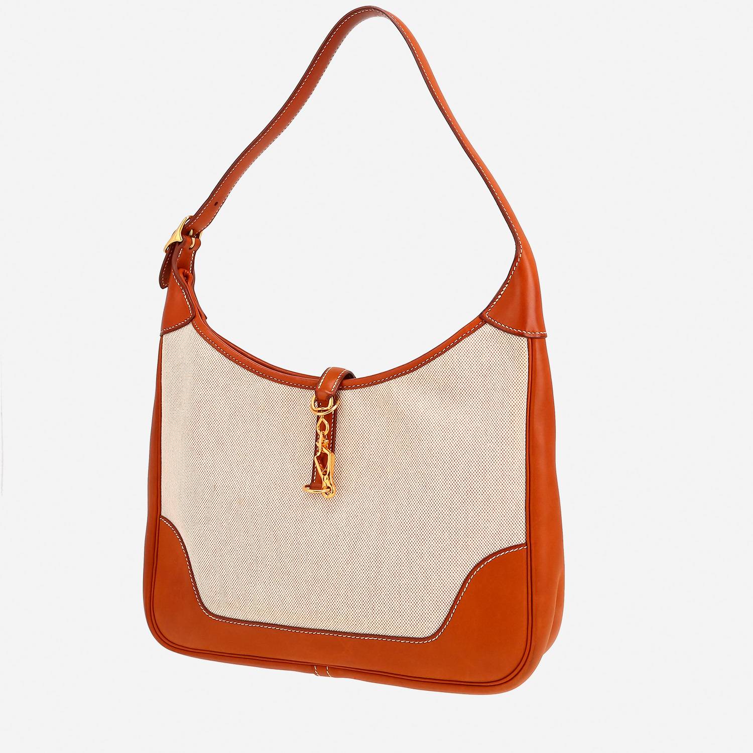 Hermès  Trim bag worn on the shoulder or carried in the hand  in fawn Barenia leather  and beige canvas