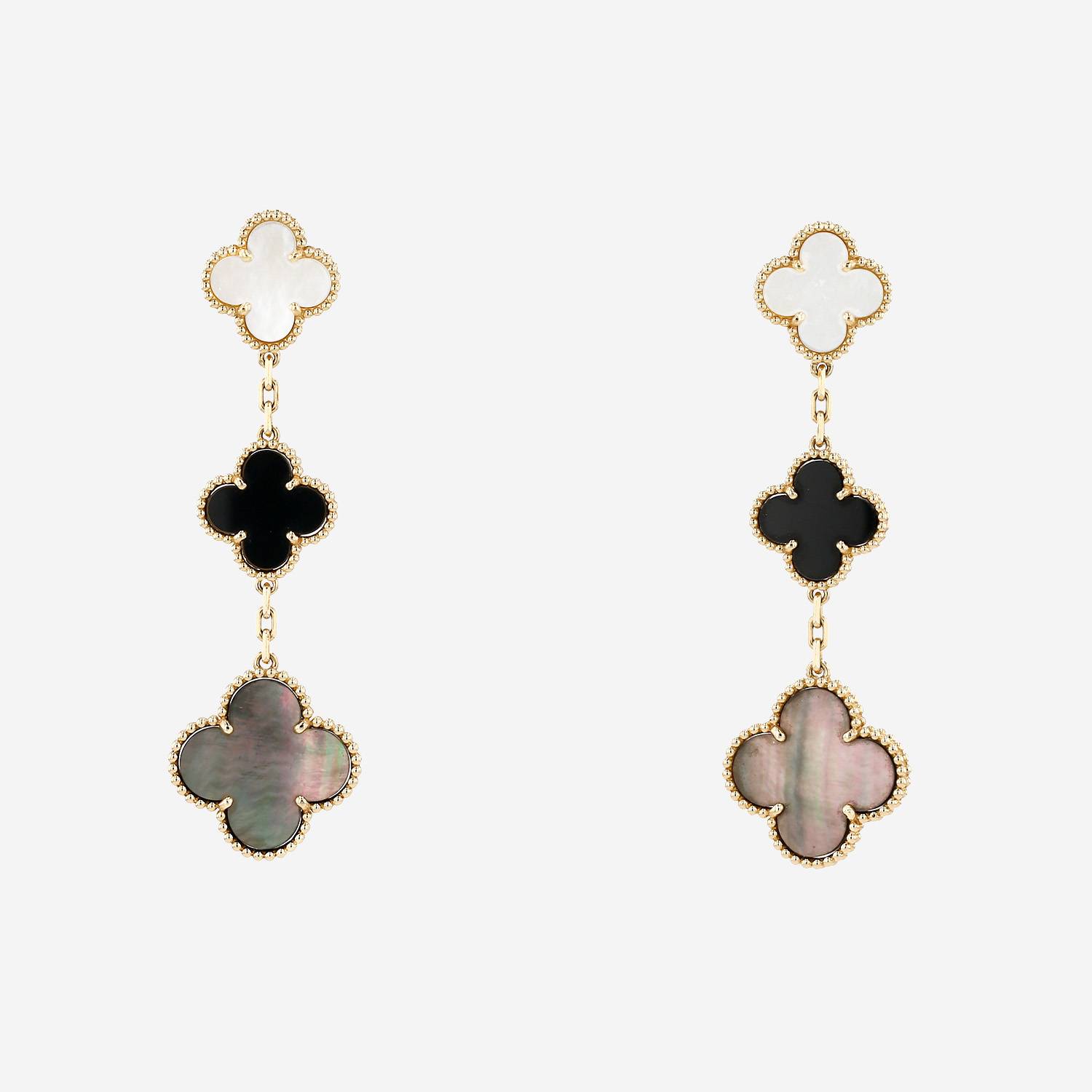 Van Cleef 
Arpels Magic Alhambra earrings in yellow gold, mother of pearl and onyx
