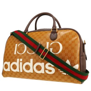 Sac de voyage Gucci   en toile sûpreme GG orange et cuir marron