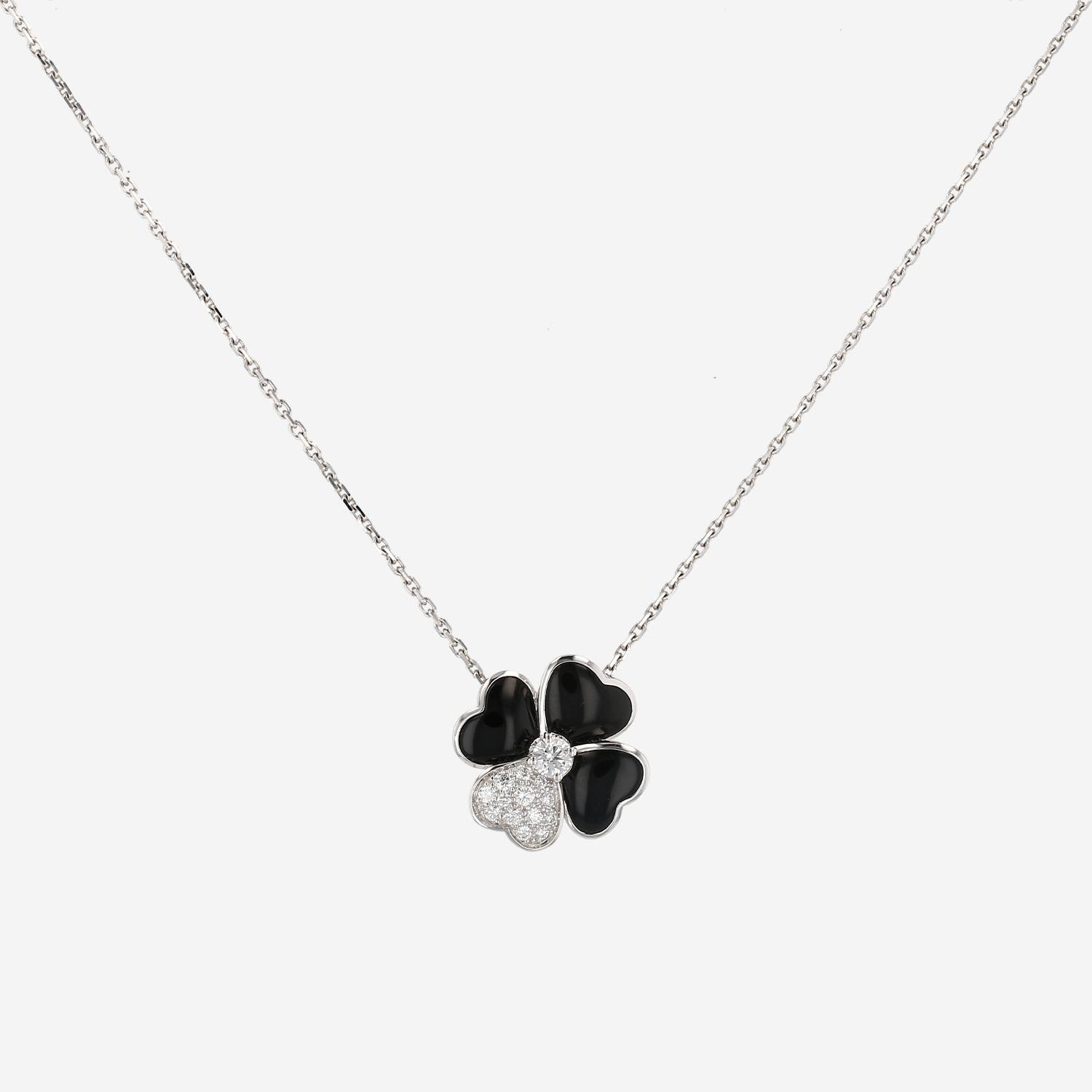 Broche-pendentif Van Cleef 
Arpels Cosmos en or blanc, diamants et onyx