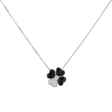 Spilla-ciondolo Van Cleef 
Arpels Cosmos in oro bianco, diamanti e onice