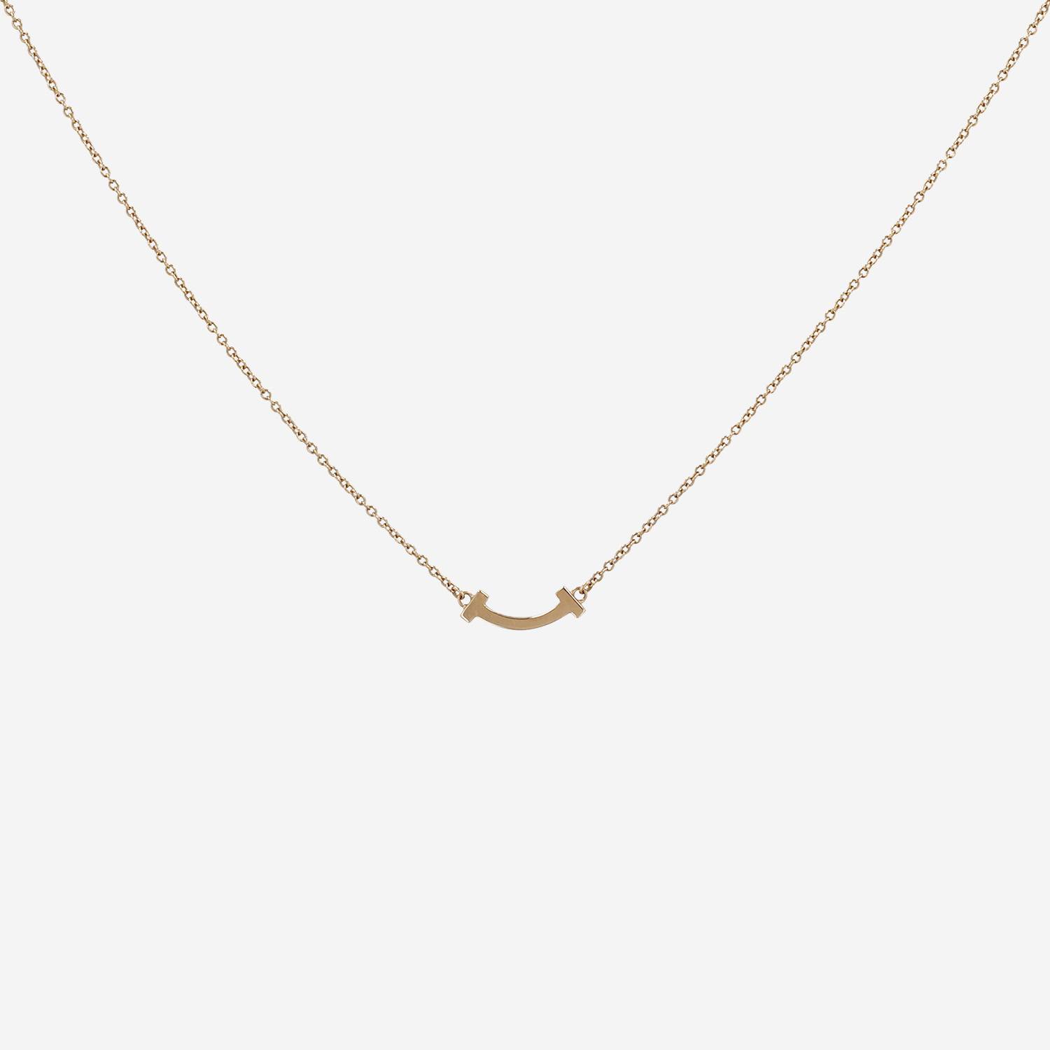 Tiffany 
Co Smile T mini necklace in pink gold