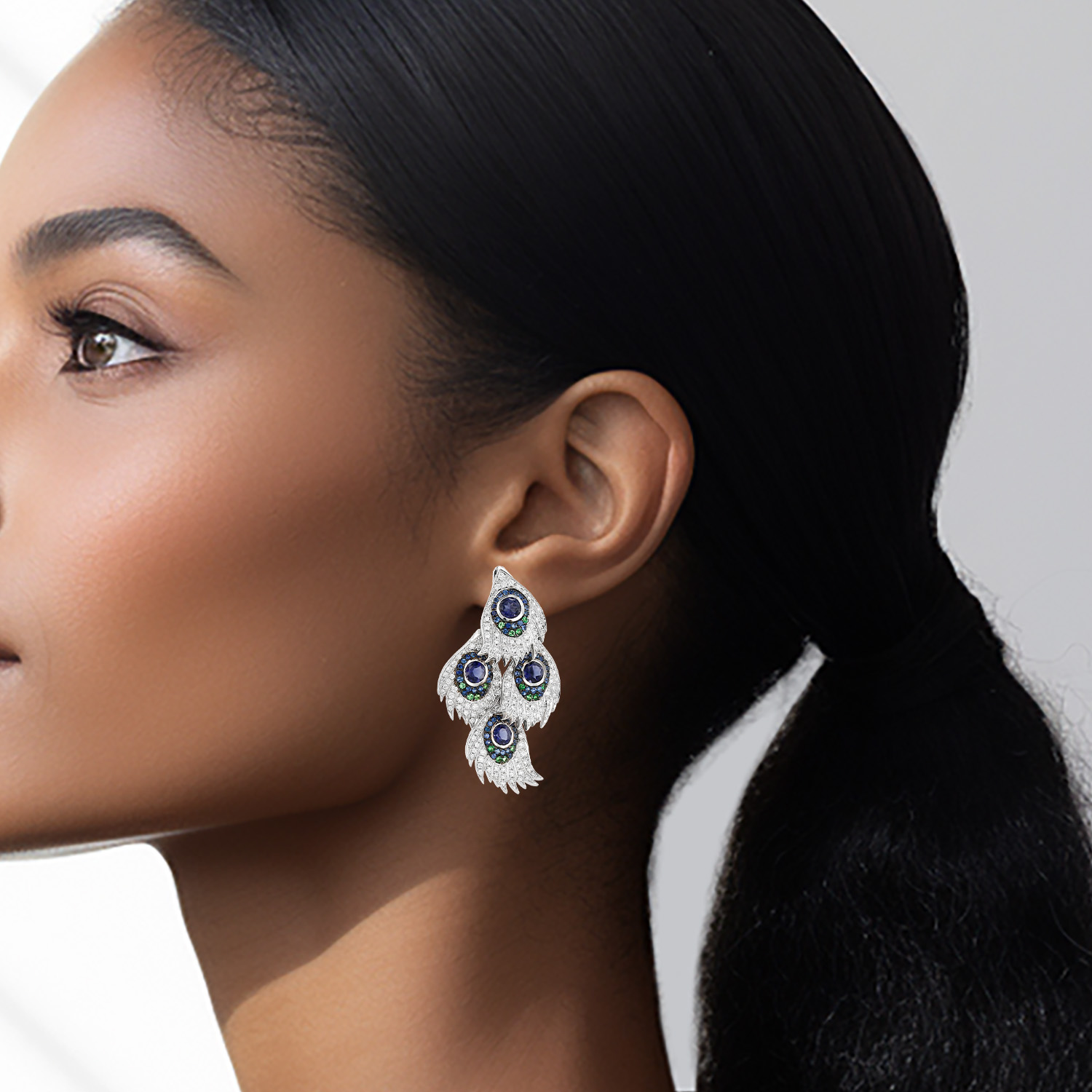 Earrings in white gold, sapphires, tsavorites and diamonds Earrings in white gold, sapphires, tsavorites and diamonds