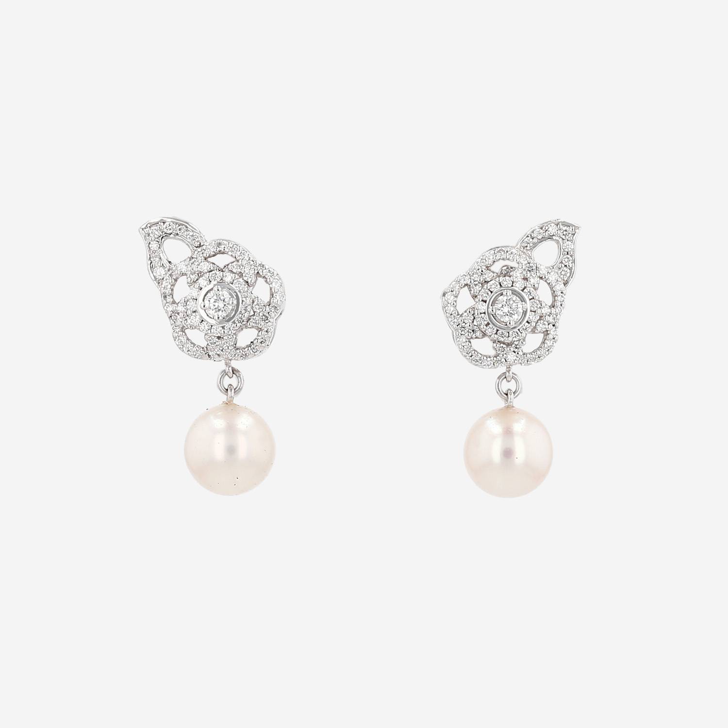 Chanel Camelia earrings in white gold, diamonds and pearls
