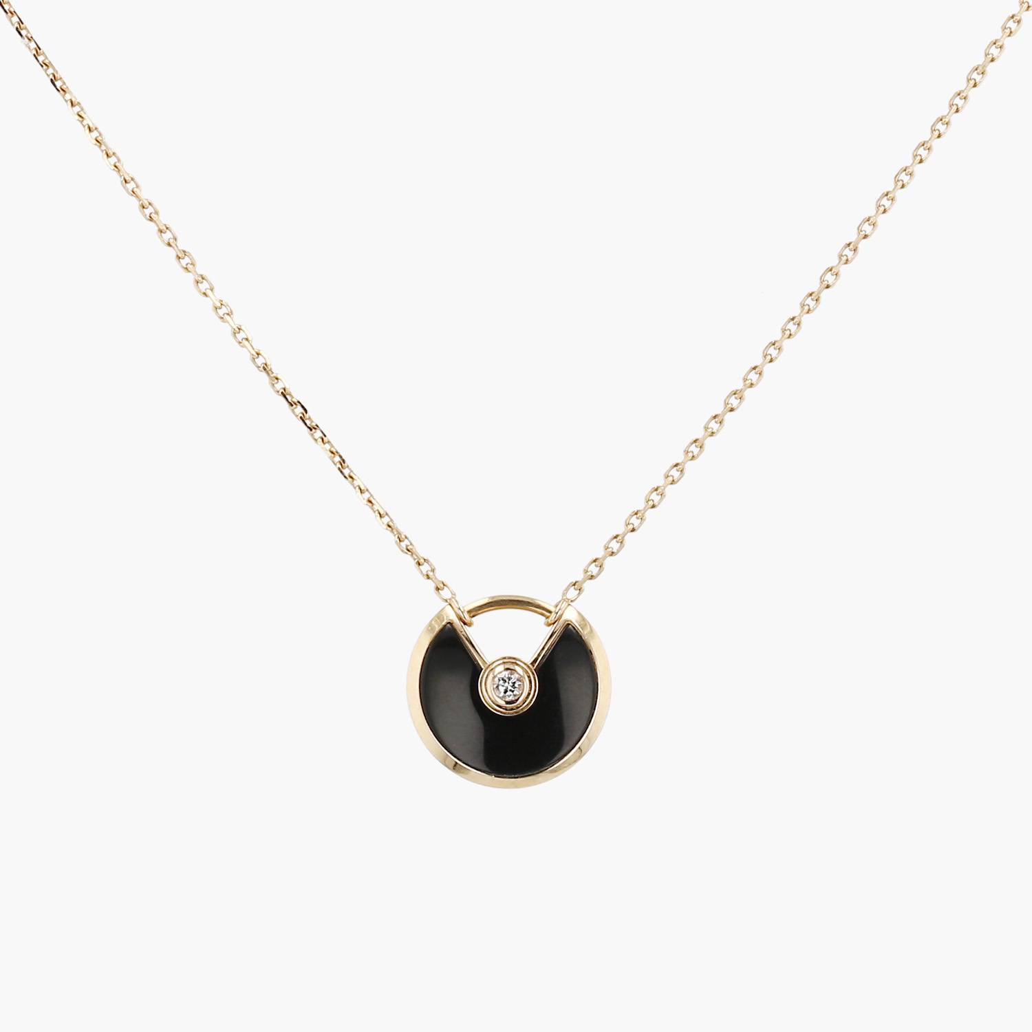 Cartier Amulette size XS necklace in yellow gold, diamond and onyx Cartier Amulette size XS necklace in yellow gold, diamond and onyx