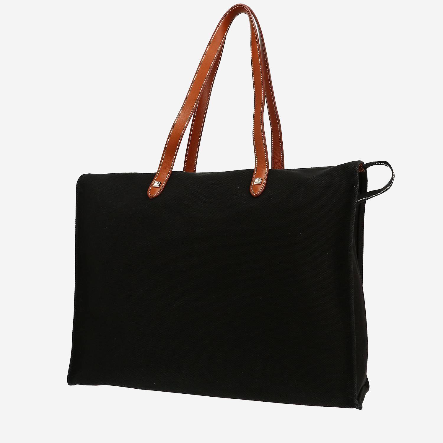 Bolso Cabás Hermès  Mira en lona negra y cuero color oro