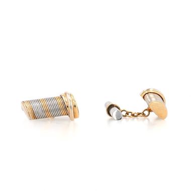 Cartier  pair of cufflinks in yellow gold and stainless steel