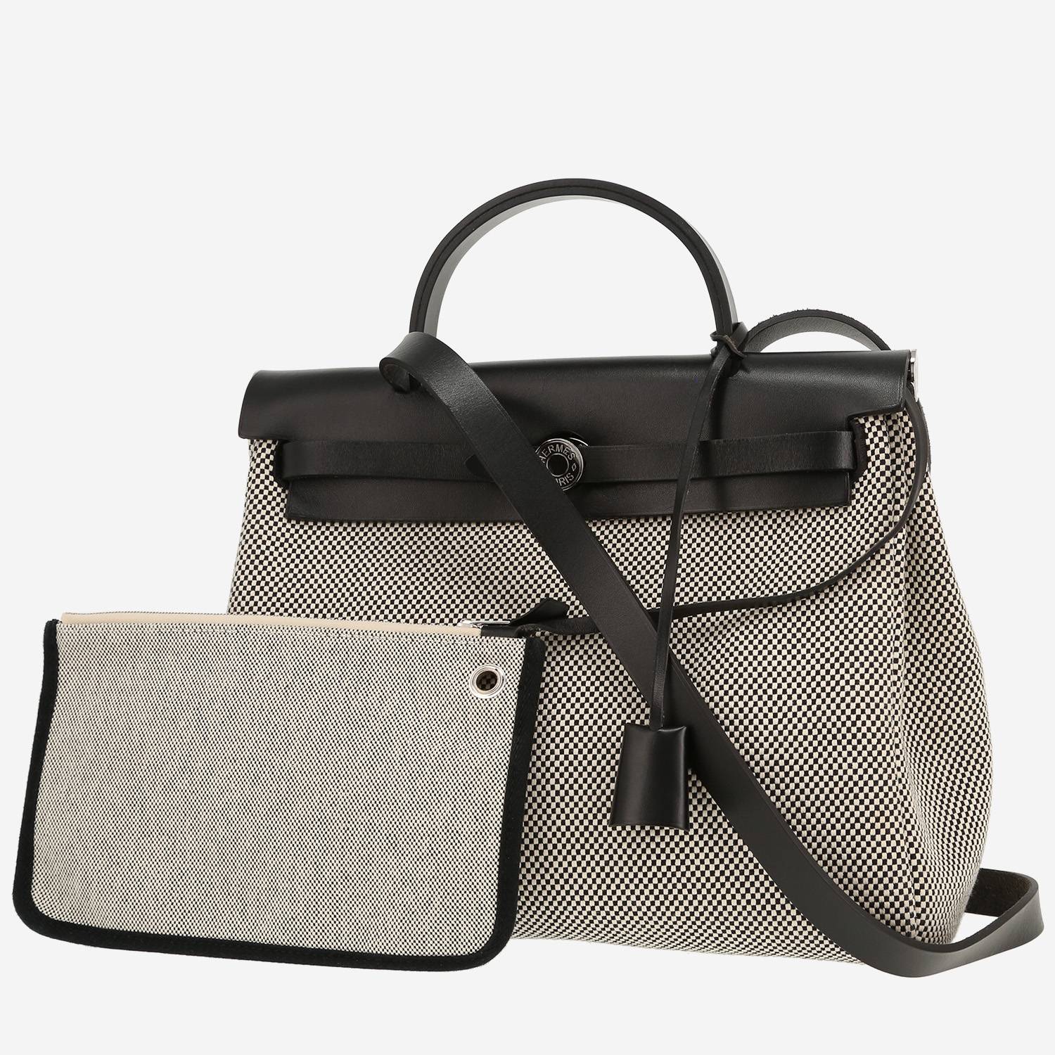 Hermès  Herbag bag worn on the shoulder or carried in the hand  in black and white canvas  and black Hunter cowhide
