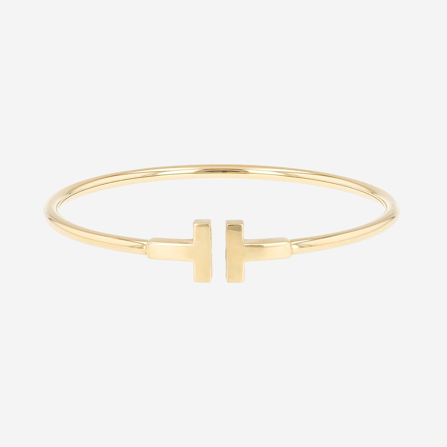 Brazalete Tiffany 
Co Tiffany T de oro amarillo