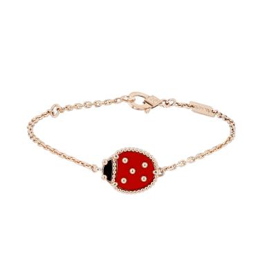 Van Cleef 
Arpels Lucky Spring bracelet in pink gold, cornelian and onyx