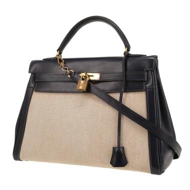 Hermès  Kelly 32 cm handbag  in navy blue box leather  and beige canvas