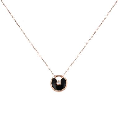 Collier Cartier Amulette petit modèle en or rose, diamant et onyx