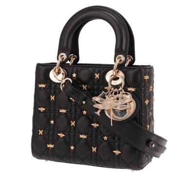 Sac à main Dior  Lady Dior petit modèle édition limitée  en cuir cannage noir