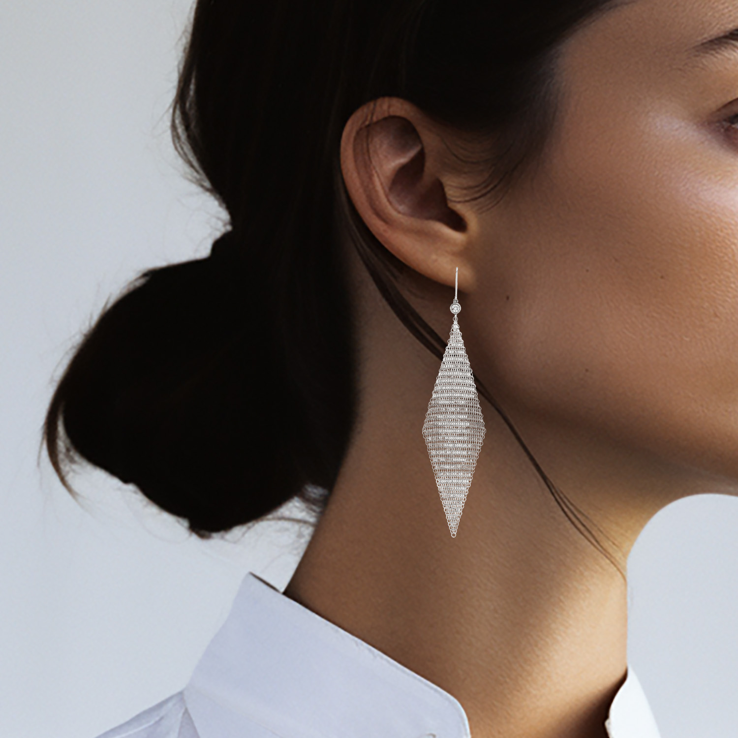 Tiffany 
Co Elsa Peretti earrings in silver and diamonds