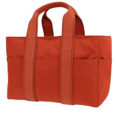 Bolso de mano Hermès  Acapulco en lona naranja y cuero naranja