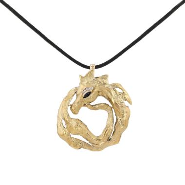 Broche-colgante de Cartier de los años 1970, en oro amarillo, ónix y diamantes