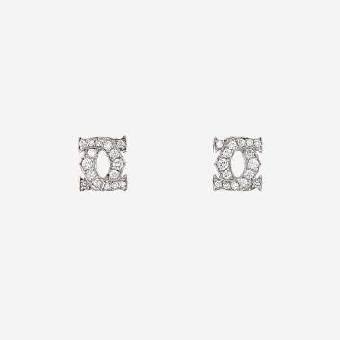 Paire de puces d'oreilles Cartier C de Cartier en or blanc et diamants