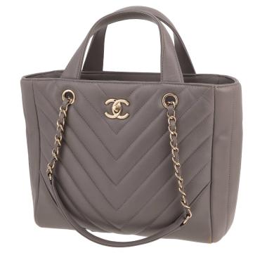 Bolso de mano Chanel  Statement Tote modelo pequeño  en cuero acolchado con motivos de espigas gris