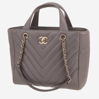 Bolso de mano Chanel  Statement Tote modelo pequeño  en cuero acolchado con motivos de espigas gris