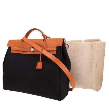 Hermès  Herbag bag worn on the shoulder or carried in the hand  in black canvas  and Hunter cowhide