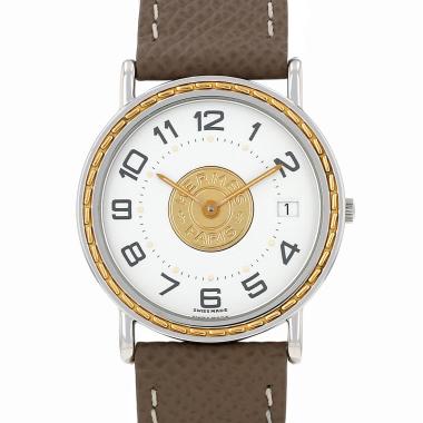 Hermès Sellier watch in gold and steel, circa 2000