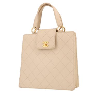 Vintage Chanel handbag in beige quilted leather