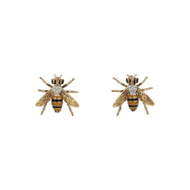 Coppia di spille vintage in oro giallo, smalto e diamanti
