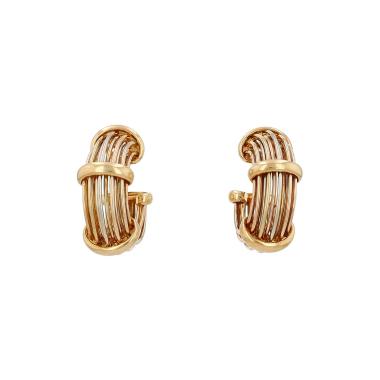 A pair of Poiray earrings in three-tone gold