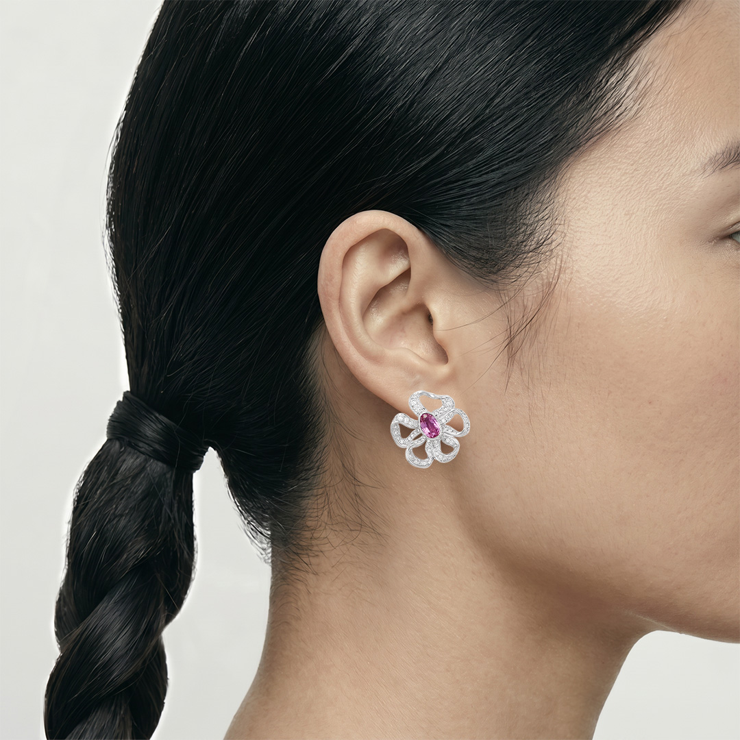 A pair of Mellerio Marie-Antoinette ear clips in white gold, sapphires and diamonds