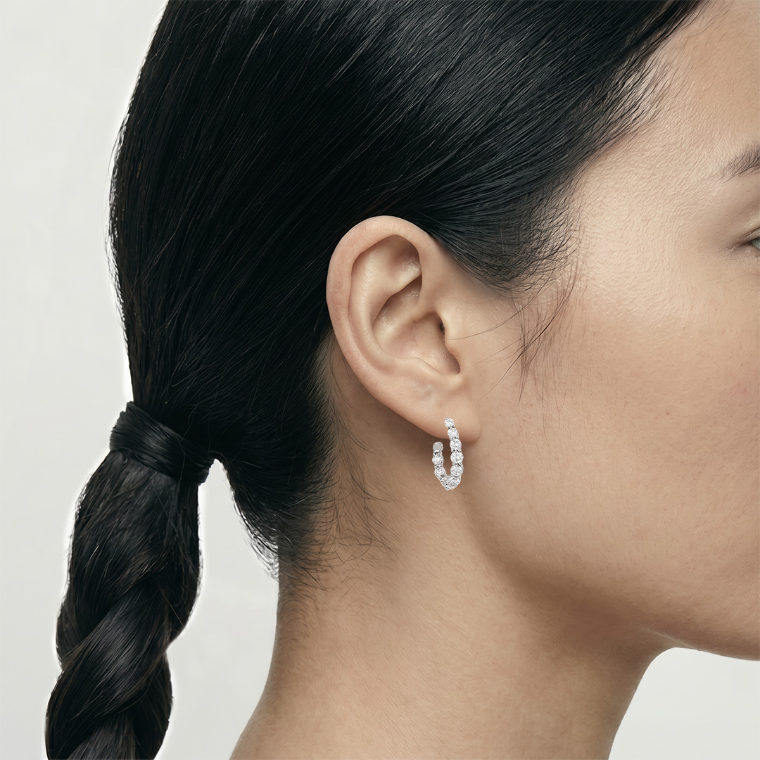 A pair of Tiffanyamp; Co Vice Versa hoop earrings in platinum and diamonds