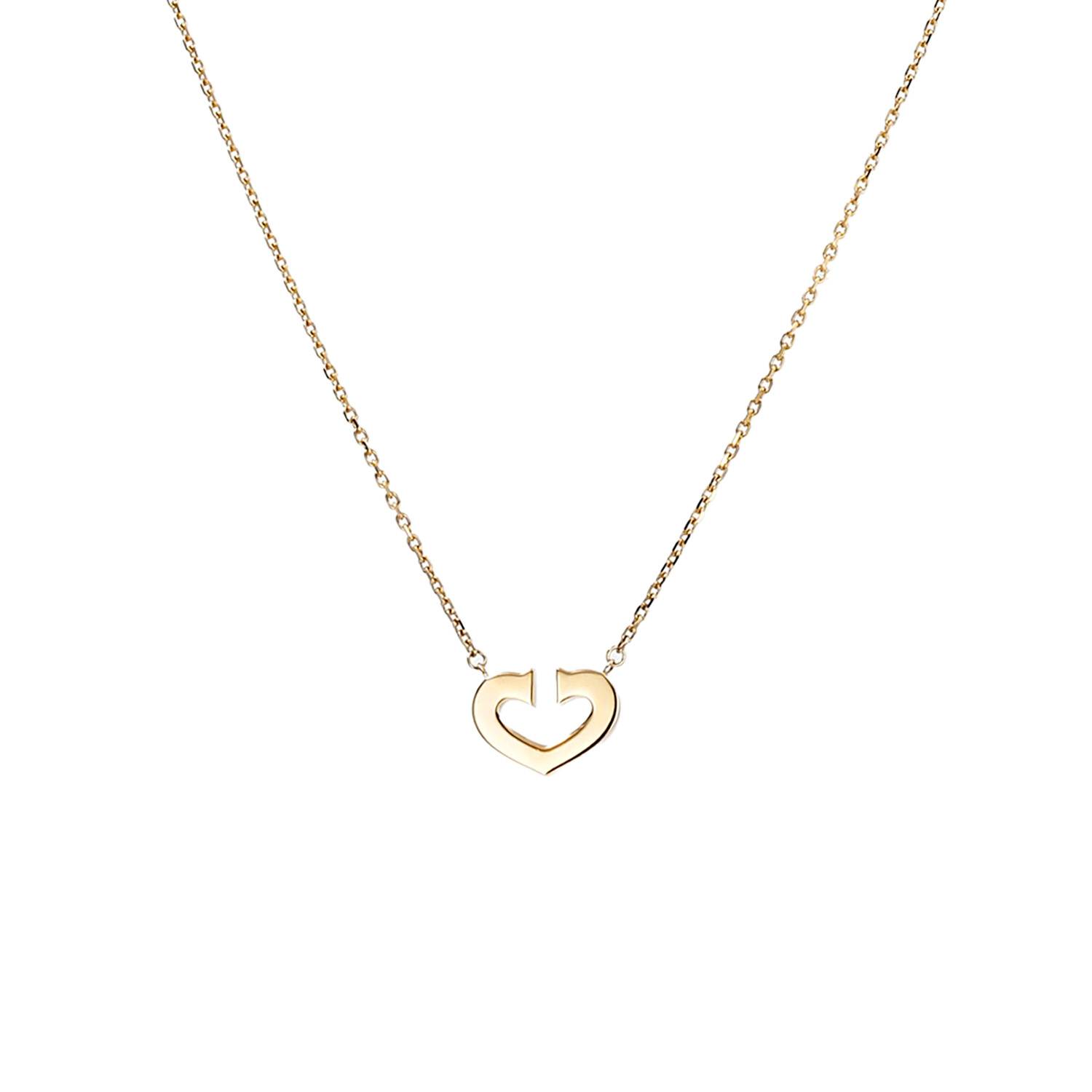 Collier Cartier Coeur et Symbole en or jaune Collier Cartier Coeur et Symbole en or jaune