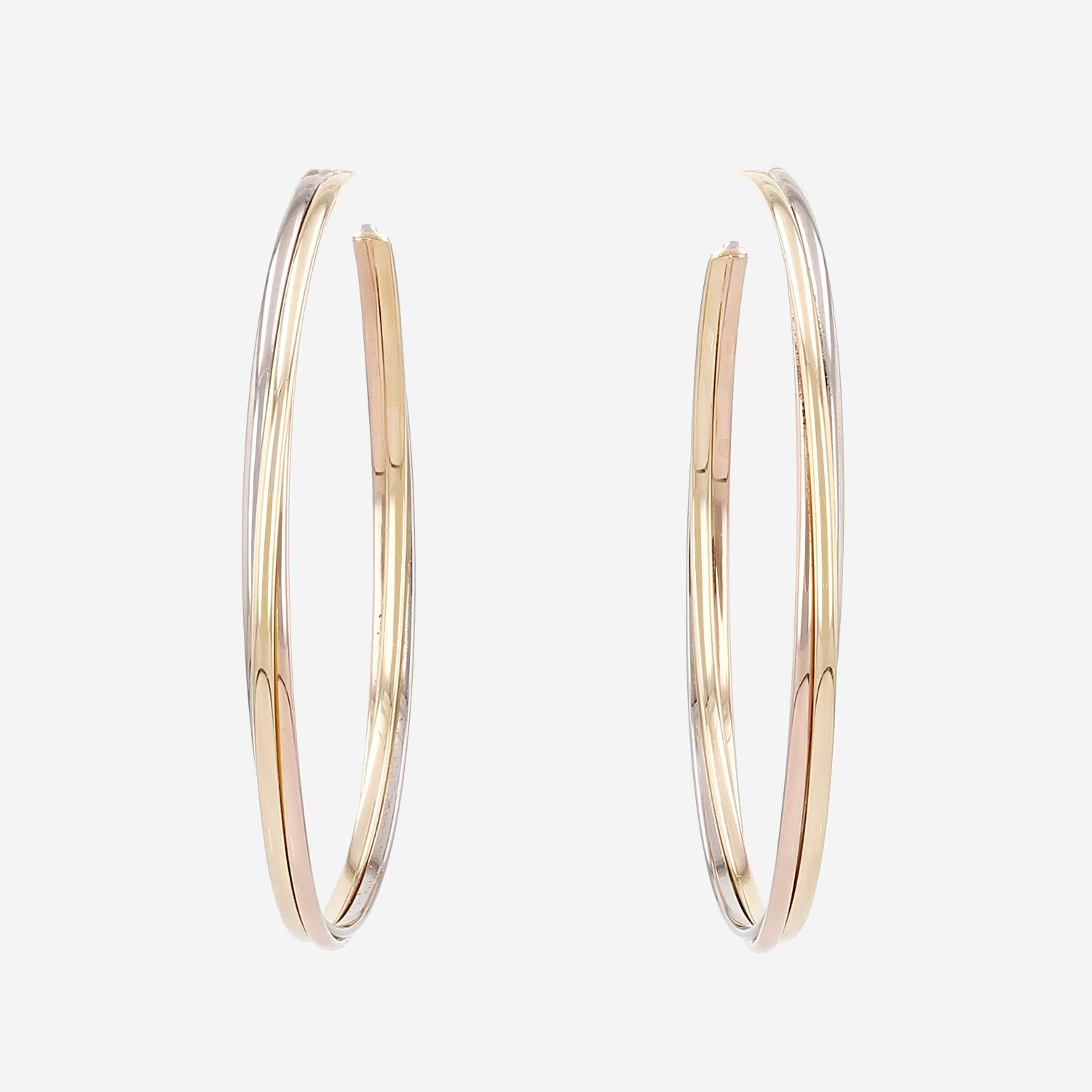 Par de aros Cartier Trinity, modelo grande, en tres tipos de oro
