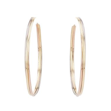 Par de aros Cartier Trinity, modelo grande, en tres tipos de oro