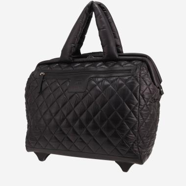 Sac de voyage Chanel  Coco Cocoon en toile matelassée noire et cuir noir