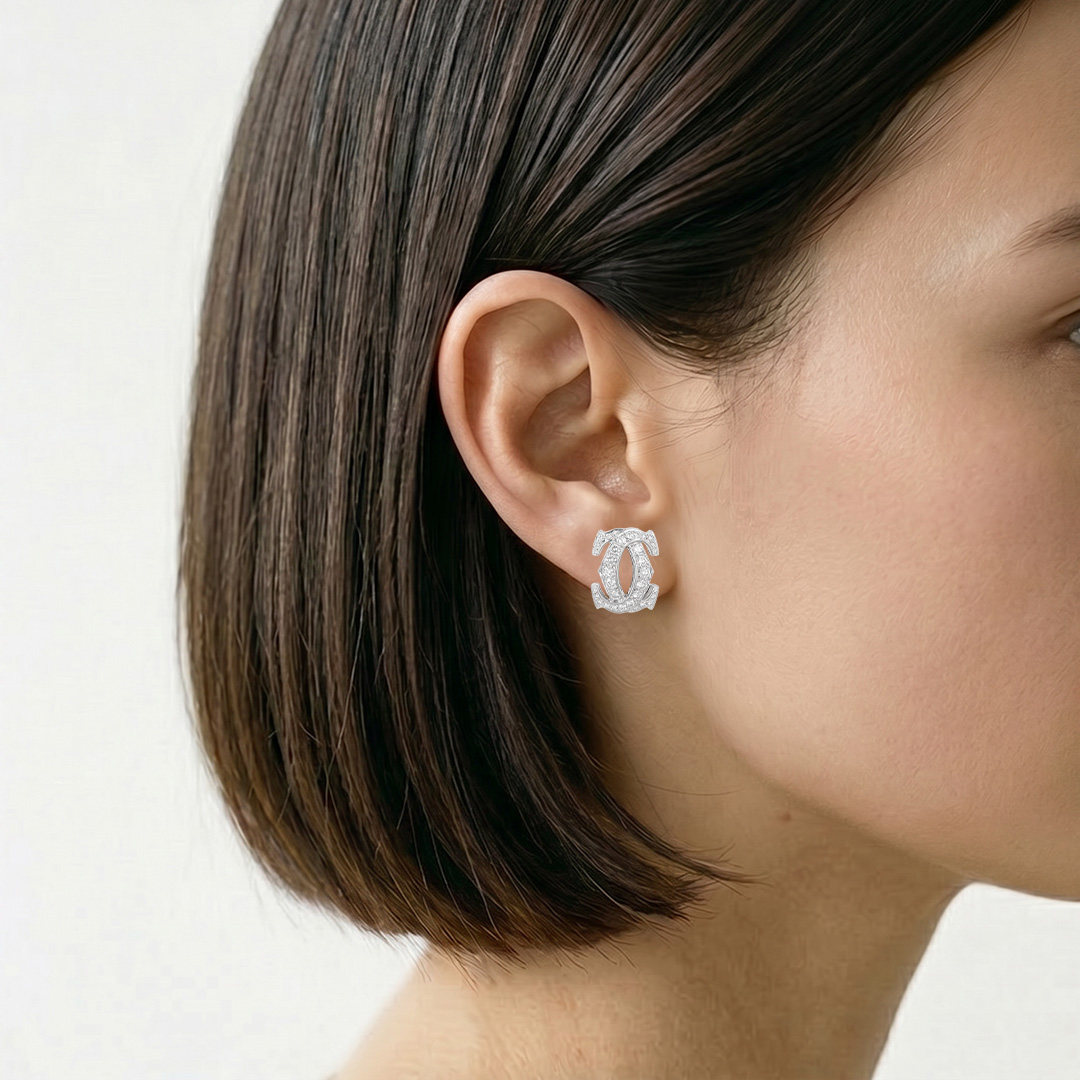 Par de pendientes de clip Cartier Pénélope en oro blanco y diamantes