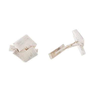 A pair of rigid Hermès cufflinks in silver