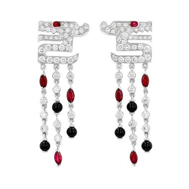 Pair of Cartier “Le Baiser du Dragon” earrings in white gold, onyx, rubies, and diamonds
