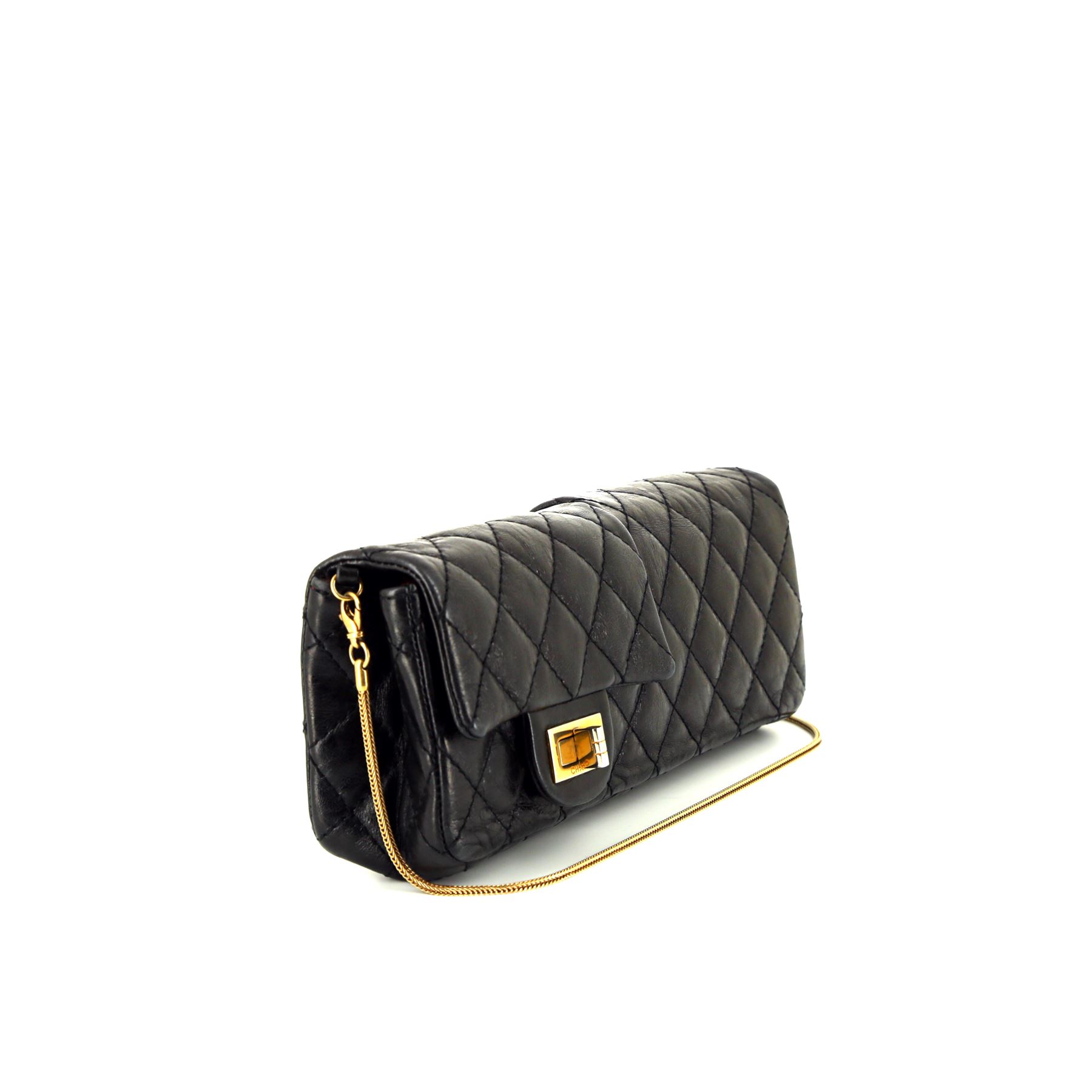 Chanel Baguette handbag/clutch in black quilted leather