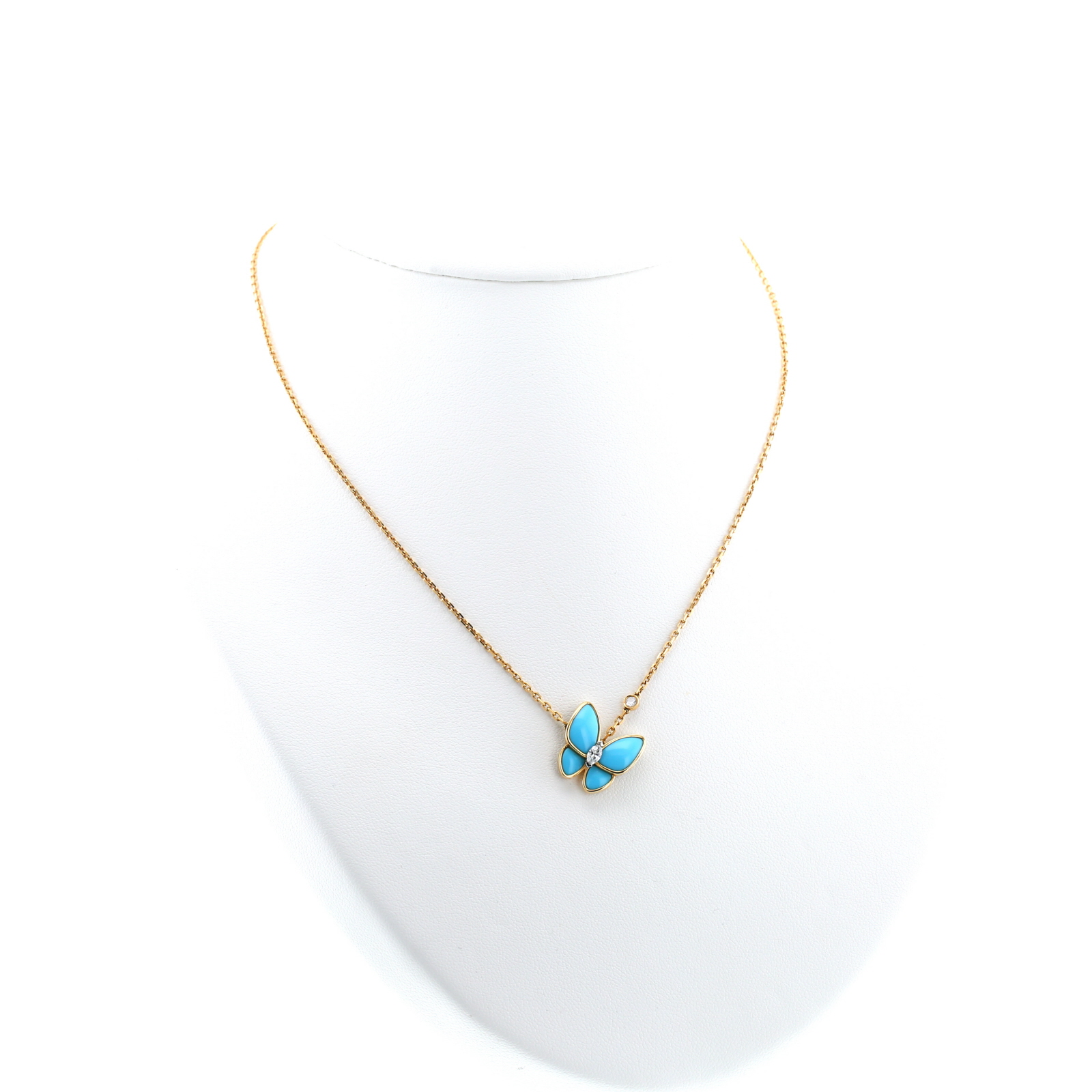 Collier Van Cleef 
Arpels Deux Papillons en or jaune, diamant et turquoise