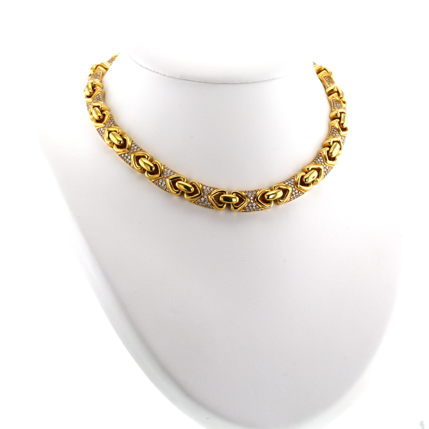Collier années 80 Bulgari Doppio Cuore en or jaune et diamants