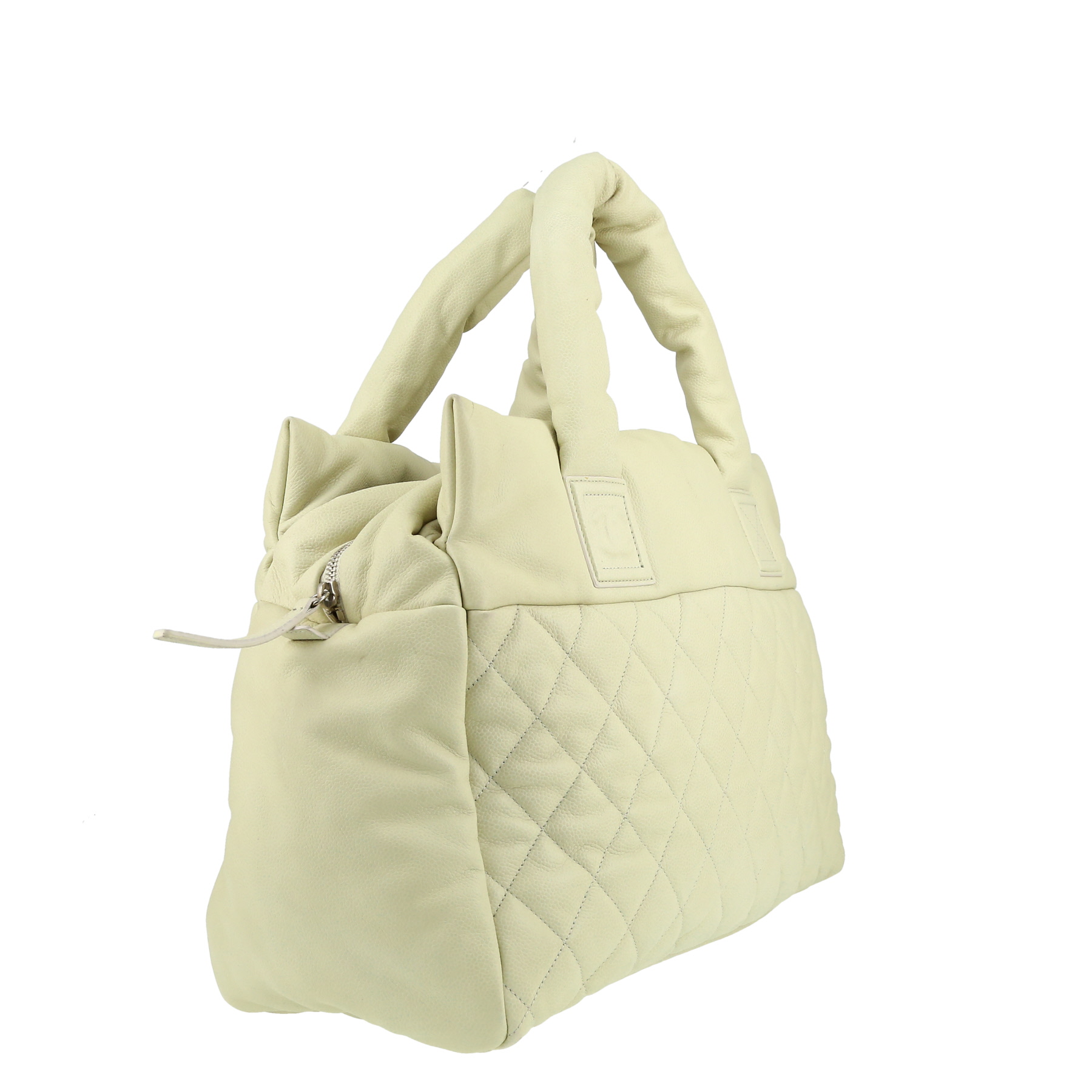 Chanel  Coco Cocoon bag worn on the shoulder or carried in the hand  in off-white quilted leather