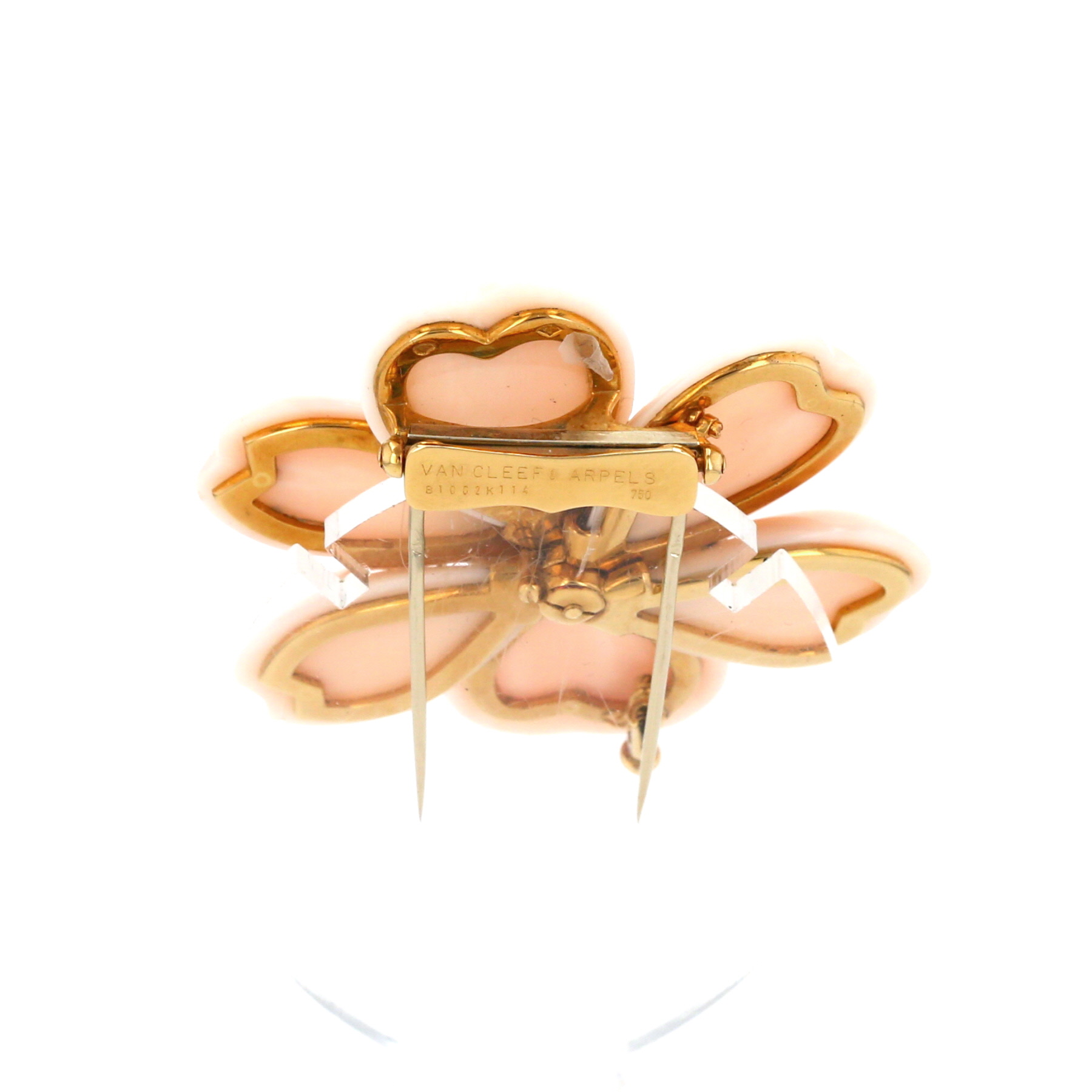 Van Cleef 
Arpels Rose de Noel brooch-pendant in yellow gold, coral and diamonds