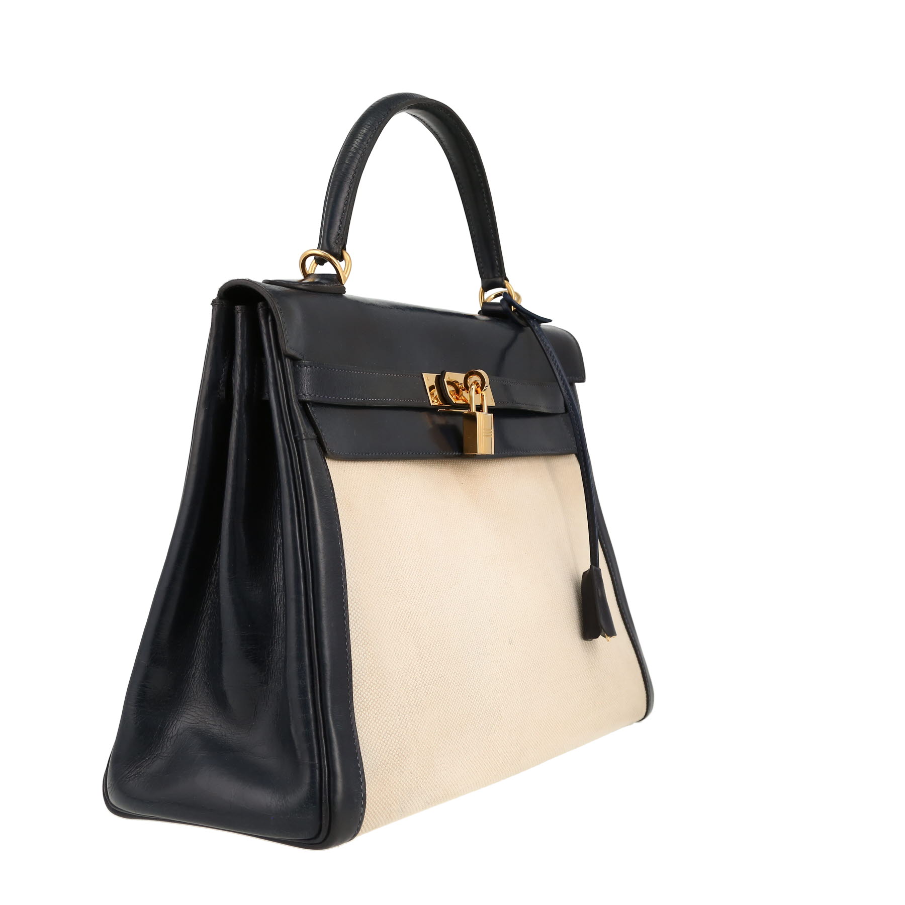 Hermès  Kelly 32 cm handbag  in navy blue box leather  and beige canvas