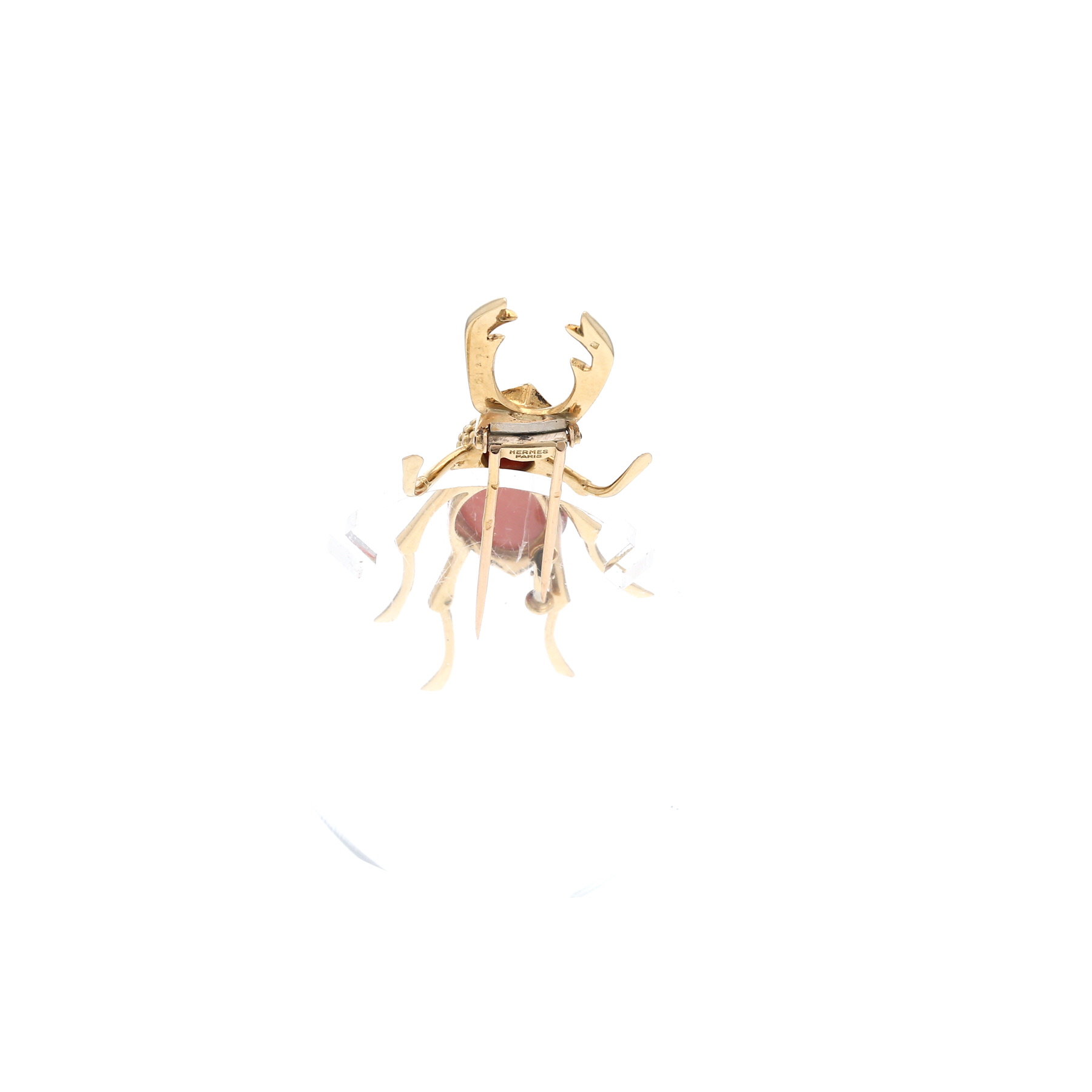 Hermès  brooch in yellow gold, onyx and coral
