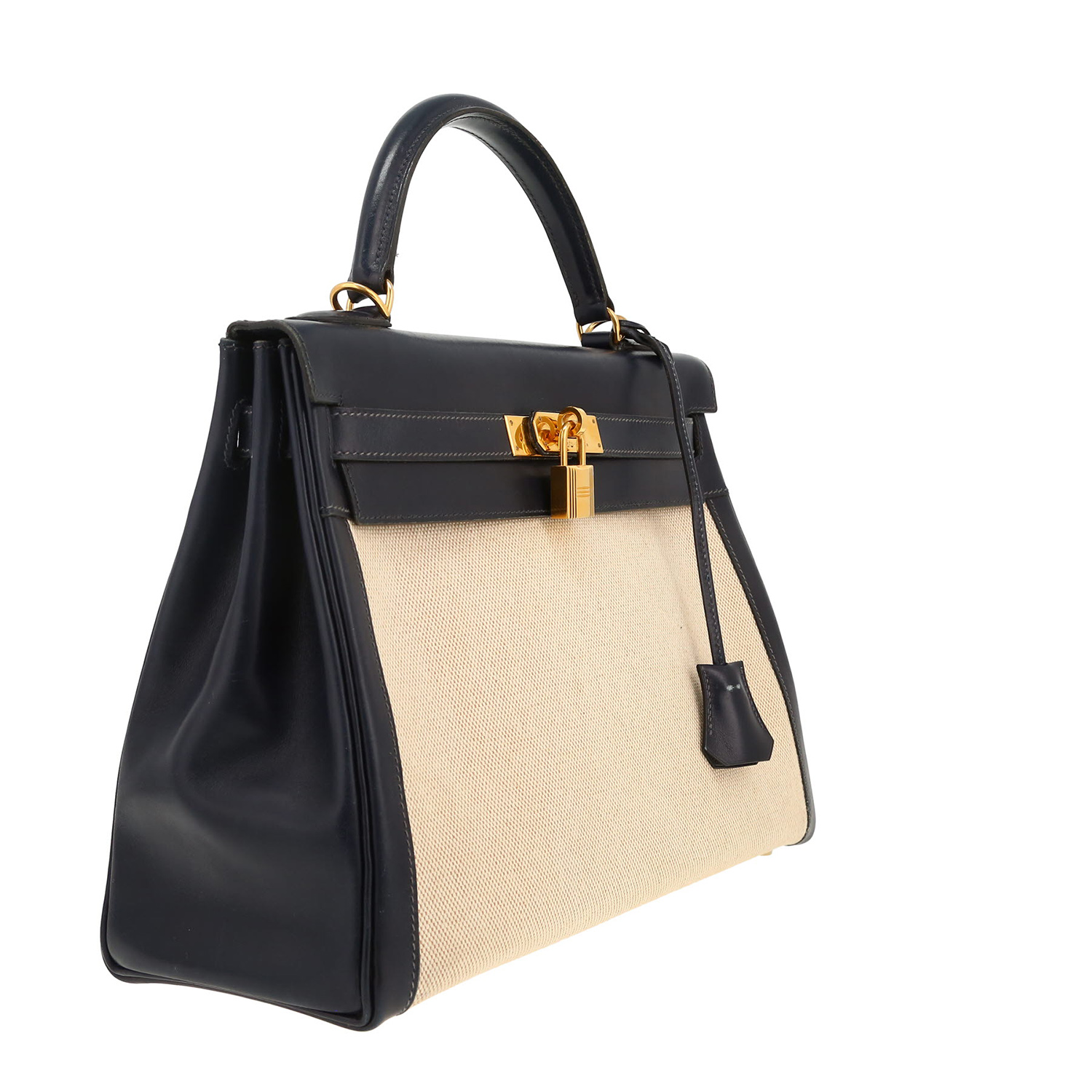 Hermès  Kelly 32 cm handbag  in navy blue box leather  and beige canvas